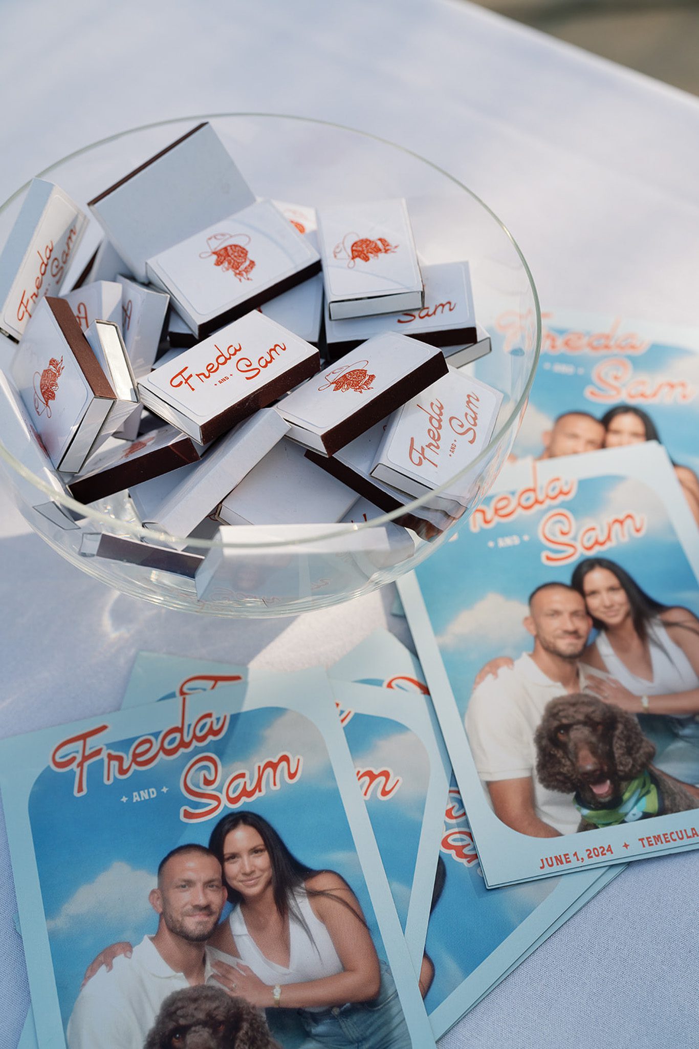 fun wedding details, including matches and cards with the couple, their wedding logo, and dog.