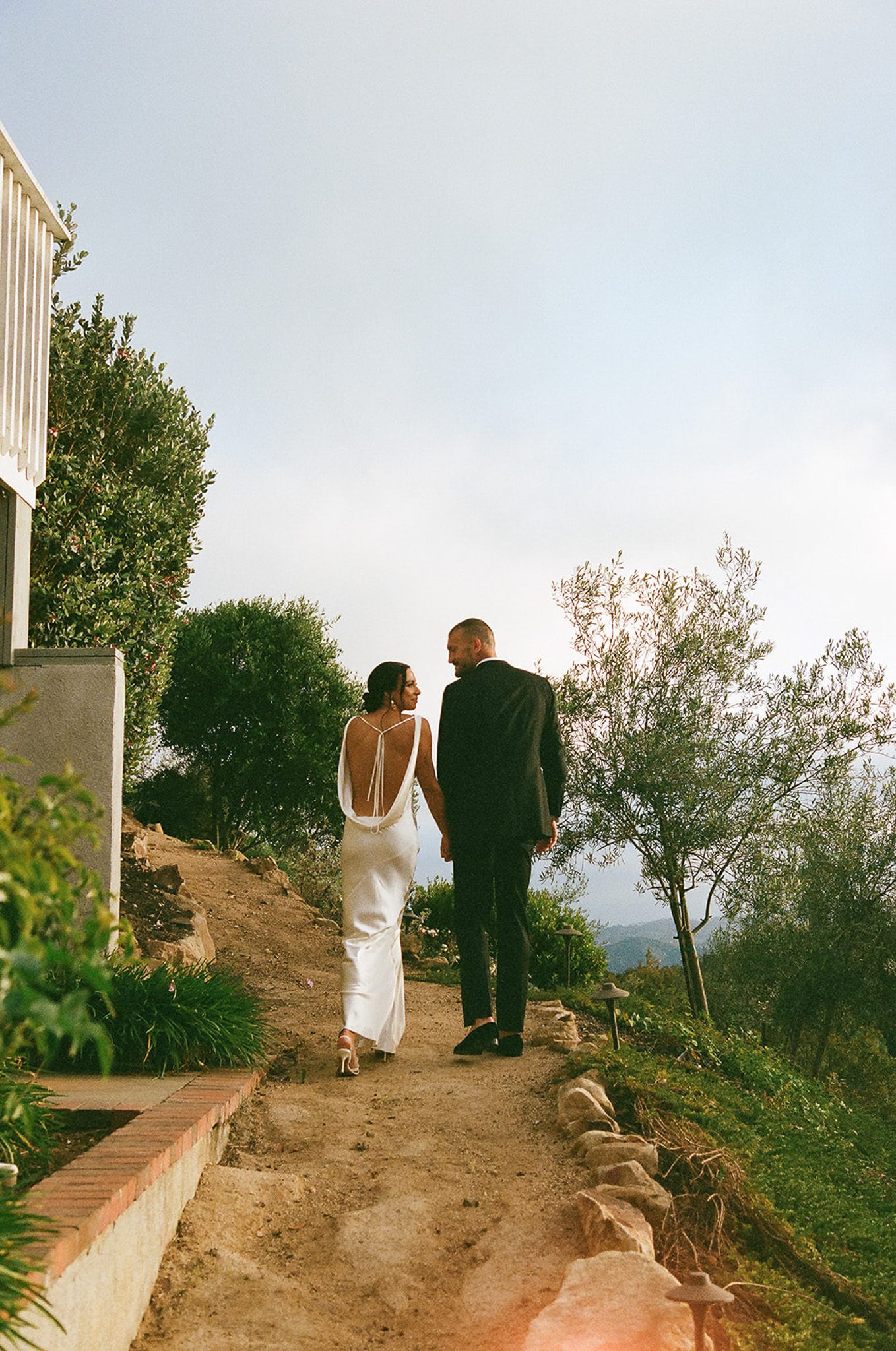 the newlyweds going for a stroll at sunset.