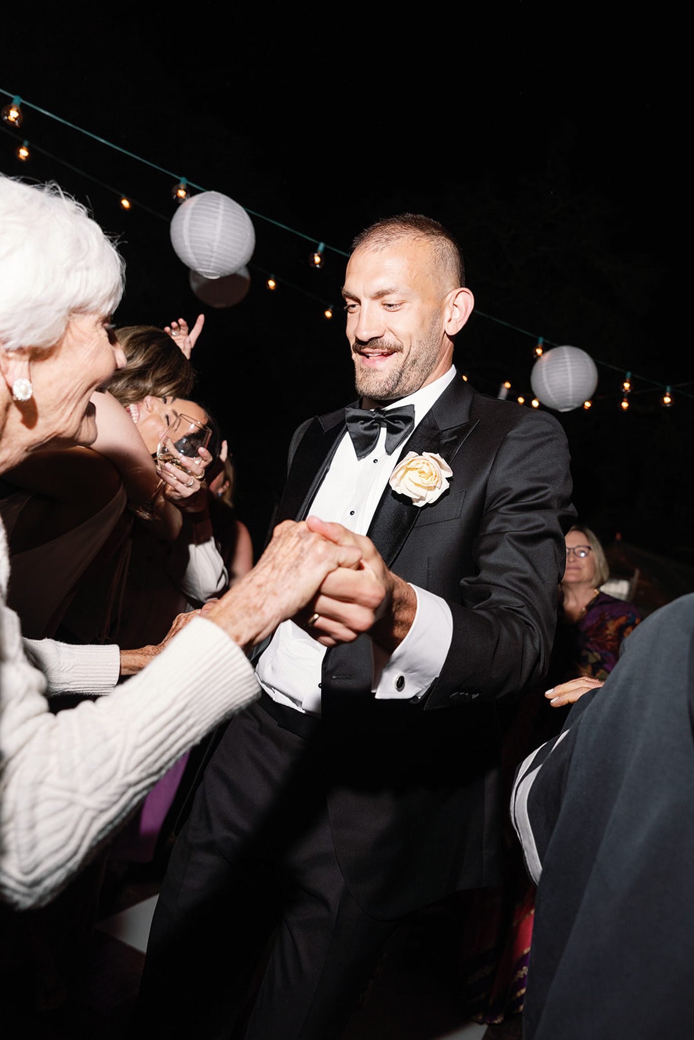 the groom dancing with his mom. 