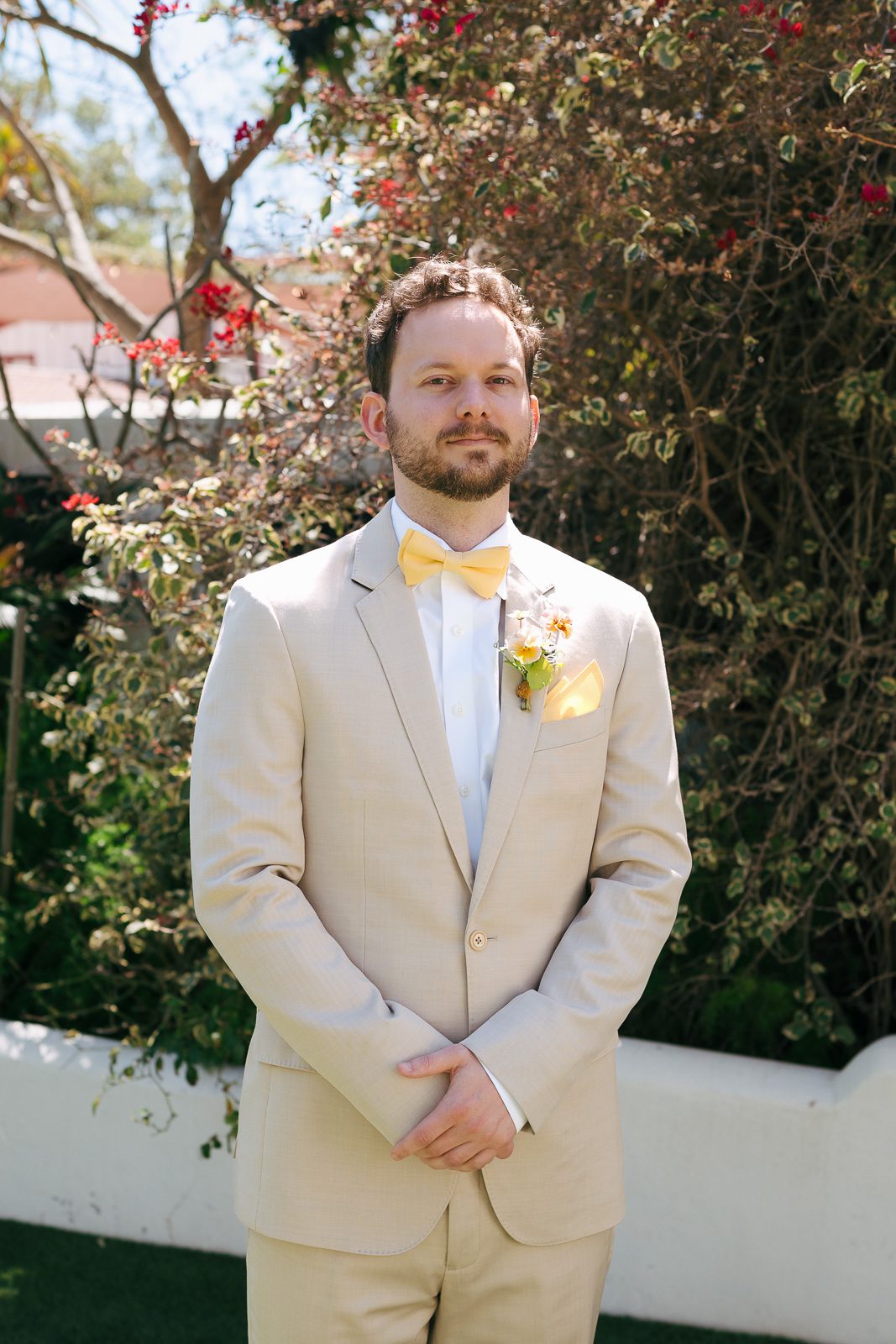 the groom posing before his Tivoli Italian Villa wedding. 