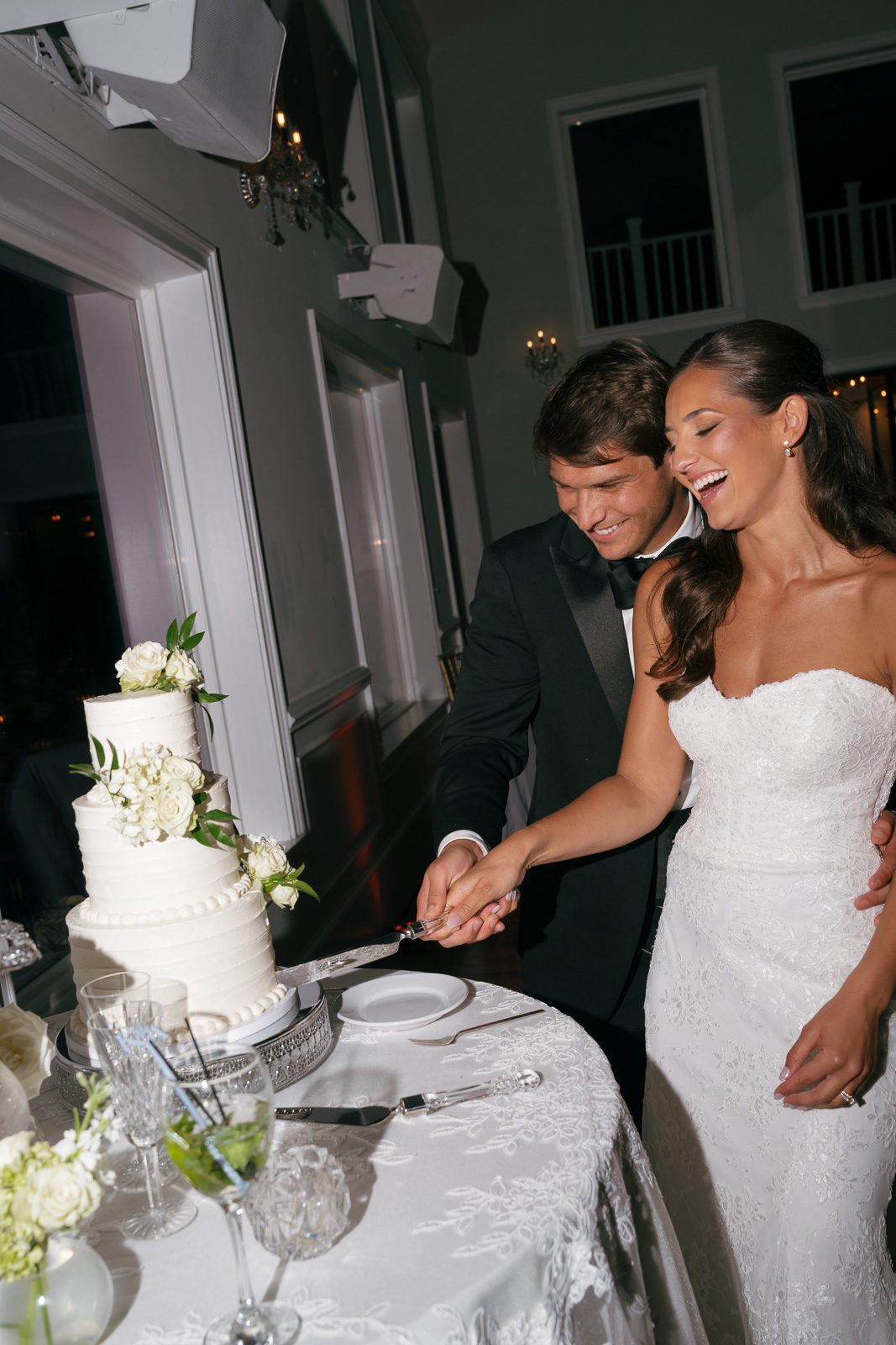 newlyweds cutting the cake during their The View At Bluemont wedding