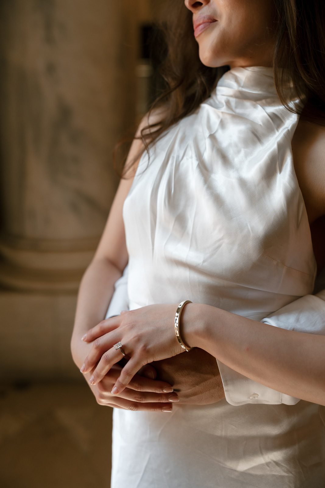 girlfriend's bracelet and dress lit up by light from a nearby window. 